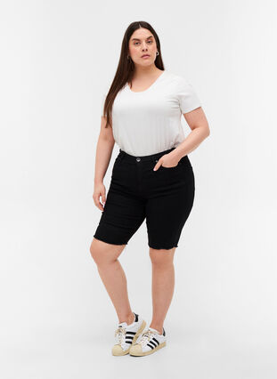 Close-fitting denim shorts with raw hems, Black, Model image number 3