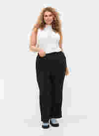 Flared trousers with pockets, Black, Model