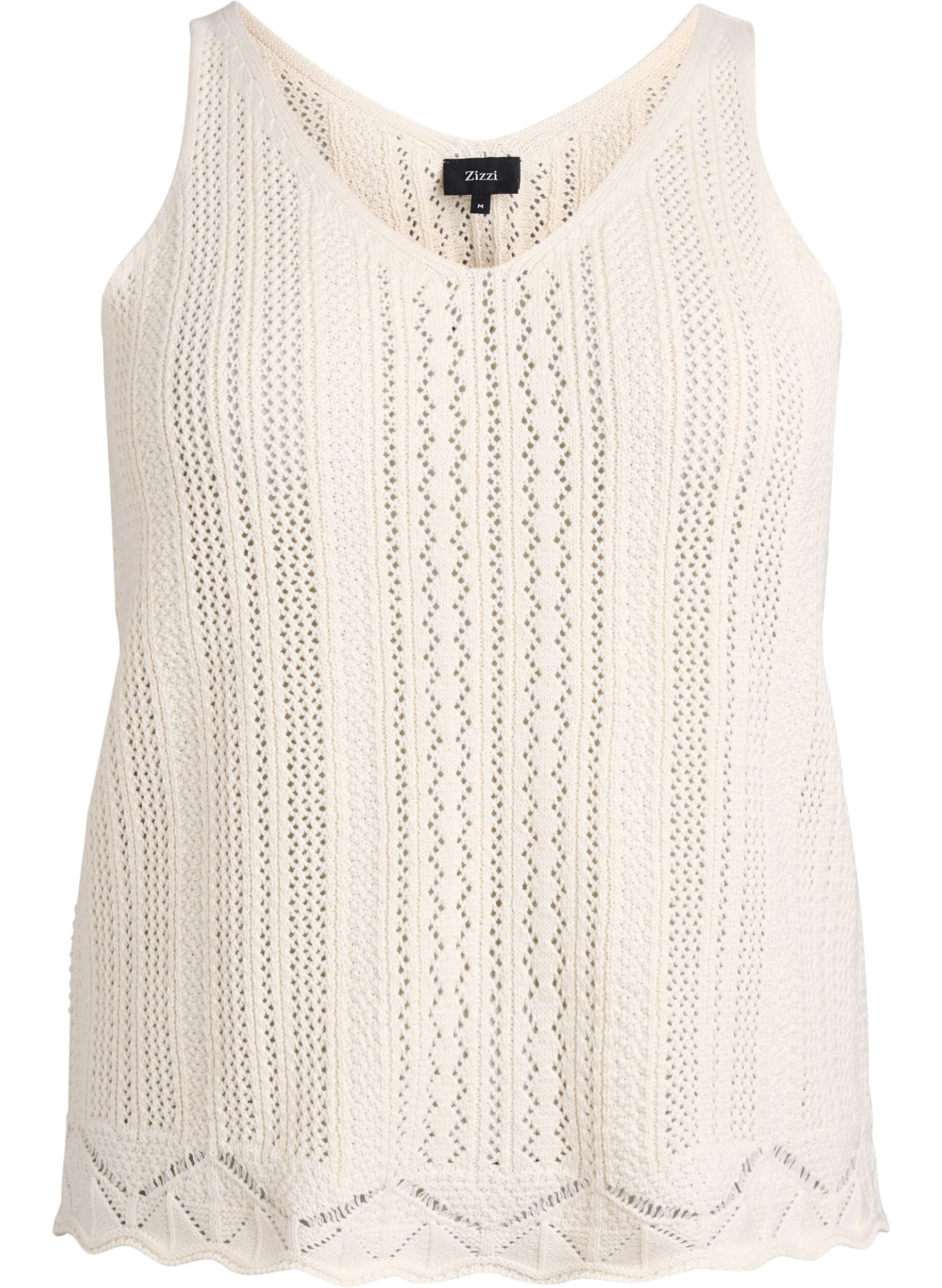 Knitted top with eyelet embroidery and V-neck
