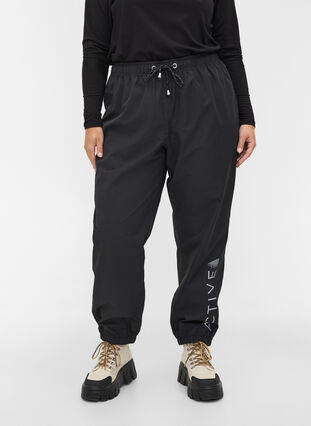 Reflective rain trousers, Black, Model image number 2