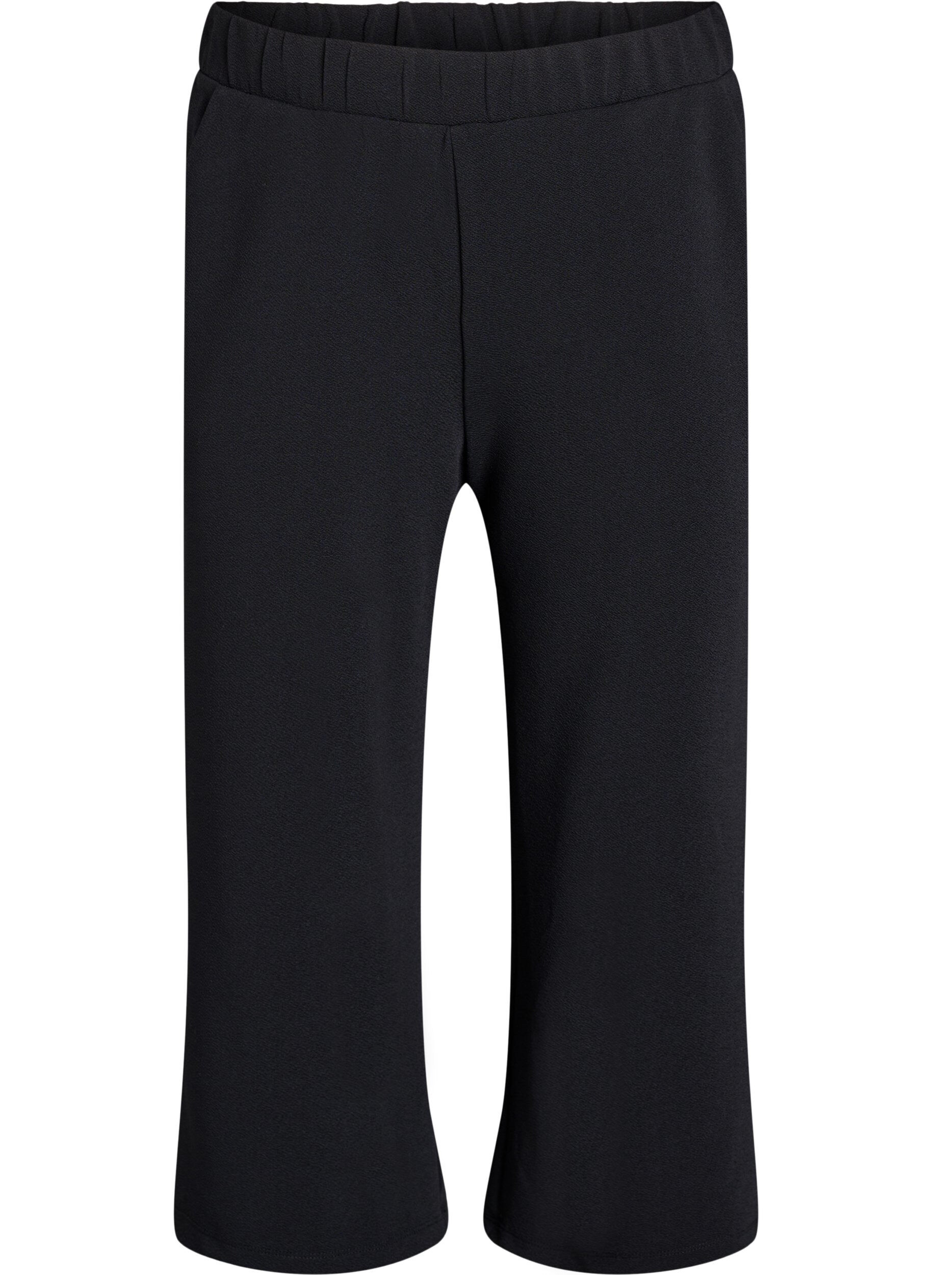 Loose trousers with 7/8 length
