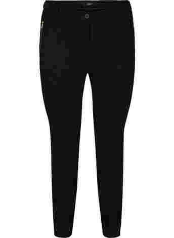 Tight-fitting trousers with pockets and a zipper