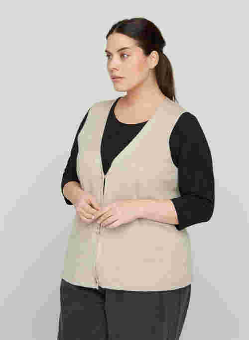 Knitted vest with a V-neck and buttons