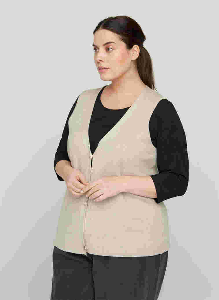 Knitted vest with a V-neck and buttons, Pumice Stone Mel., Model