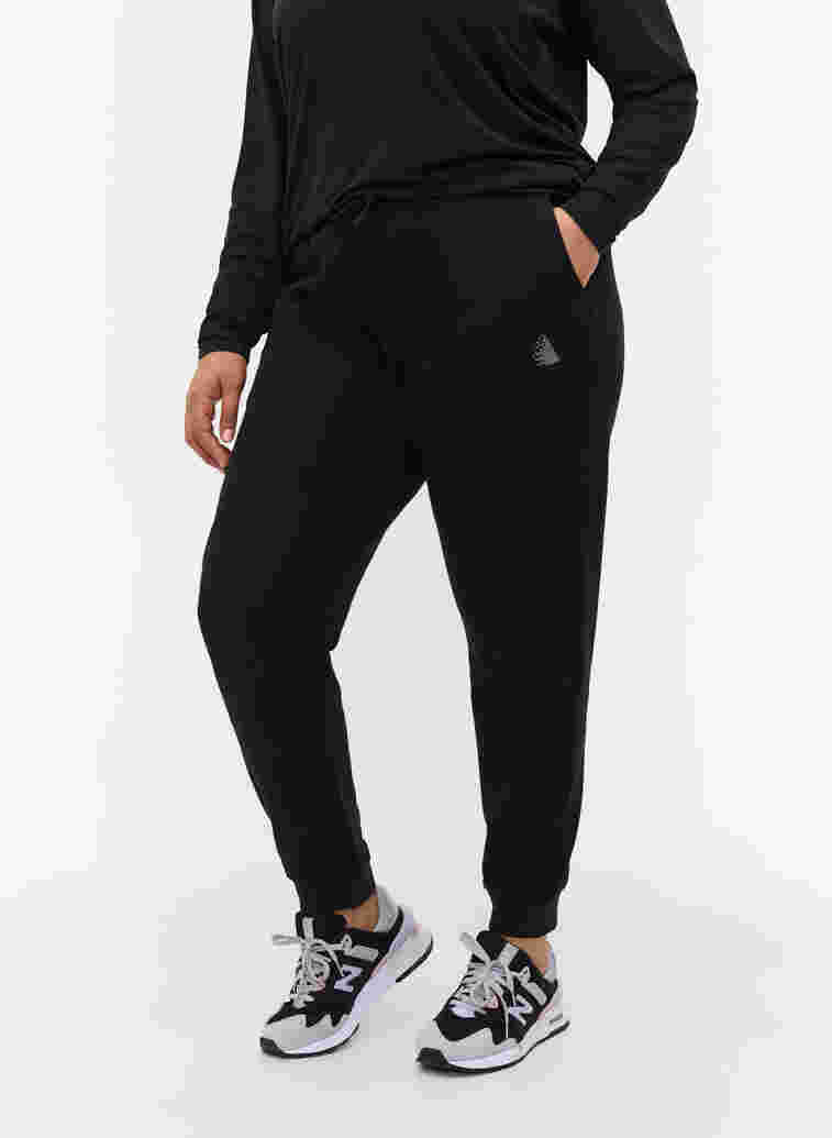 Plain sports pants with pockets, Black, Model image number 2
