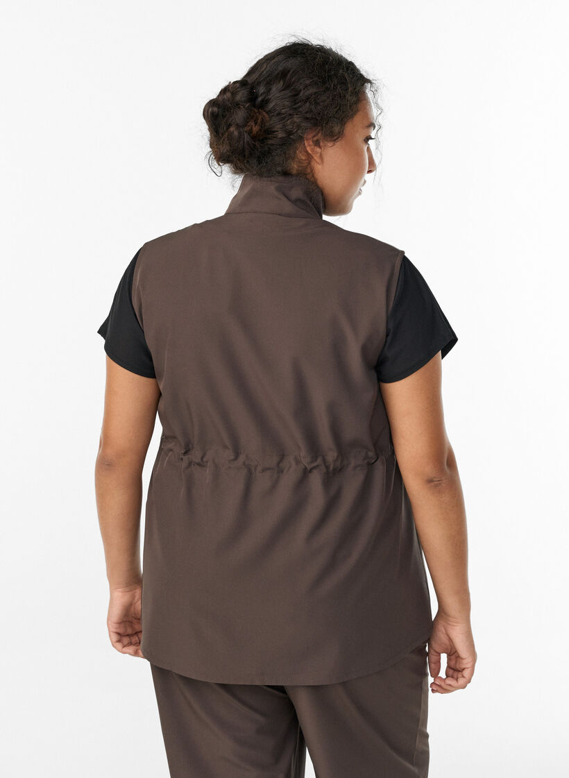 Sleeveless vest with an elasticated waist, Brown, Model