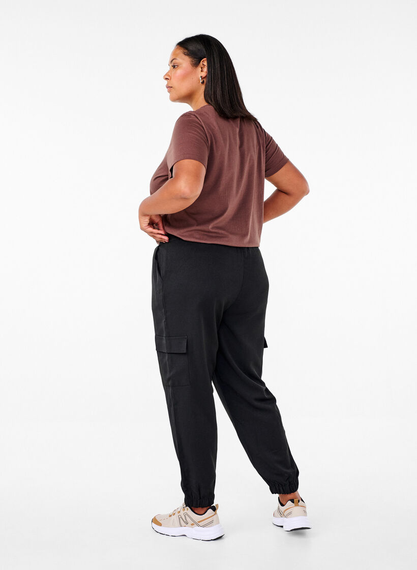 Trousers with cargo pockets and elasticated waist, Black, Model image number 1