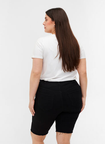 Close-fitting denim shorts with raw hems, Black, Model image number 1