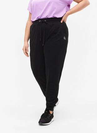 Loose workout trousers with pockets, Black, Model image number 0