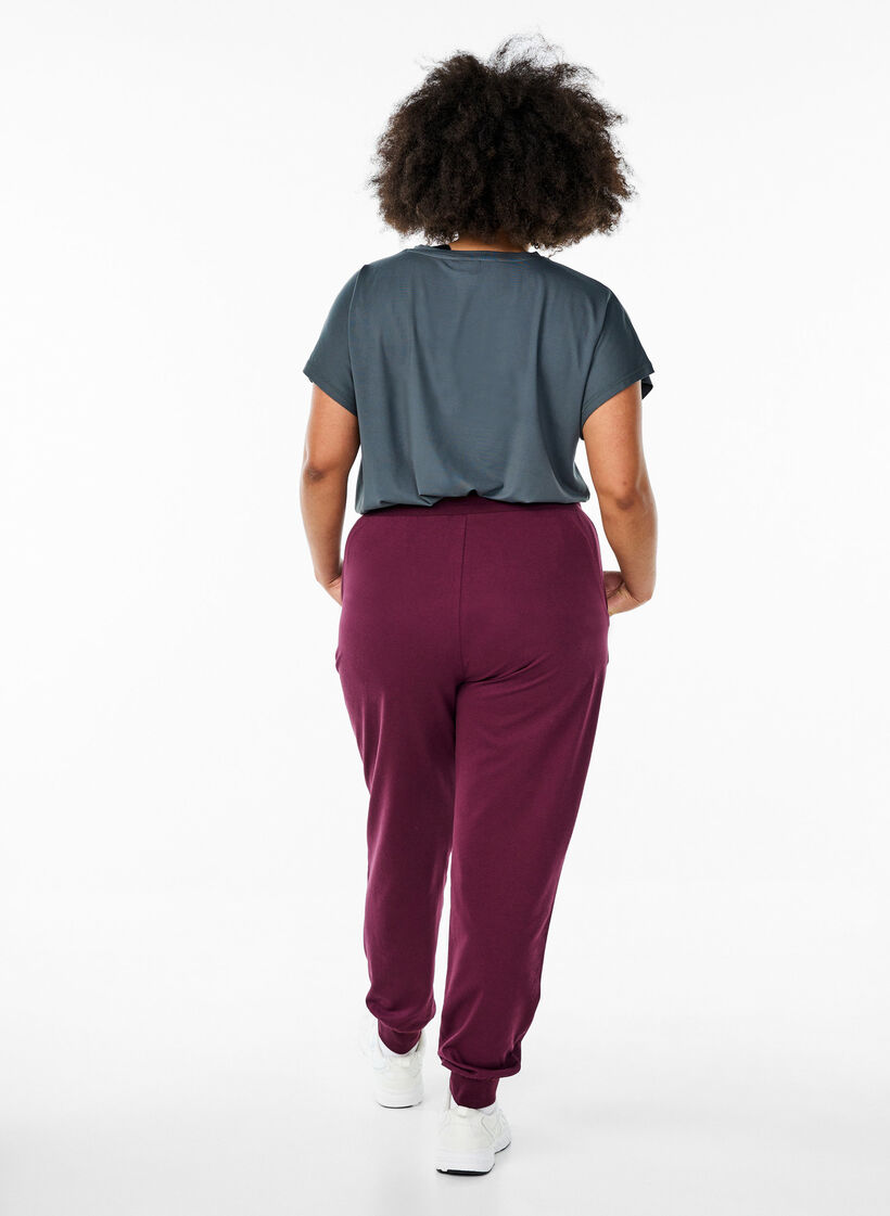 Loose tracksuit trousers with pockets, Red, Model image number 2