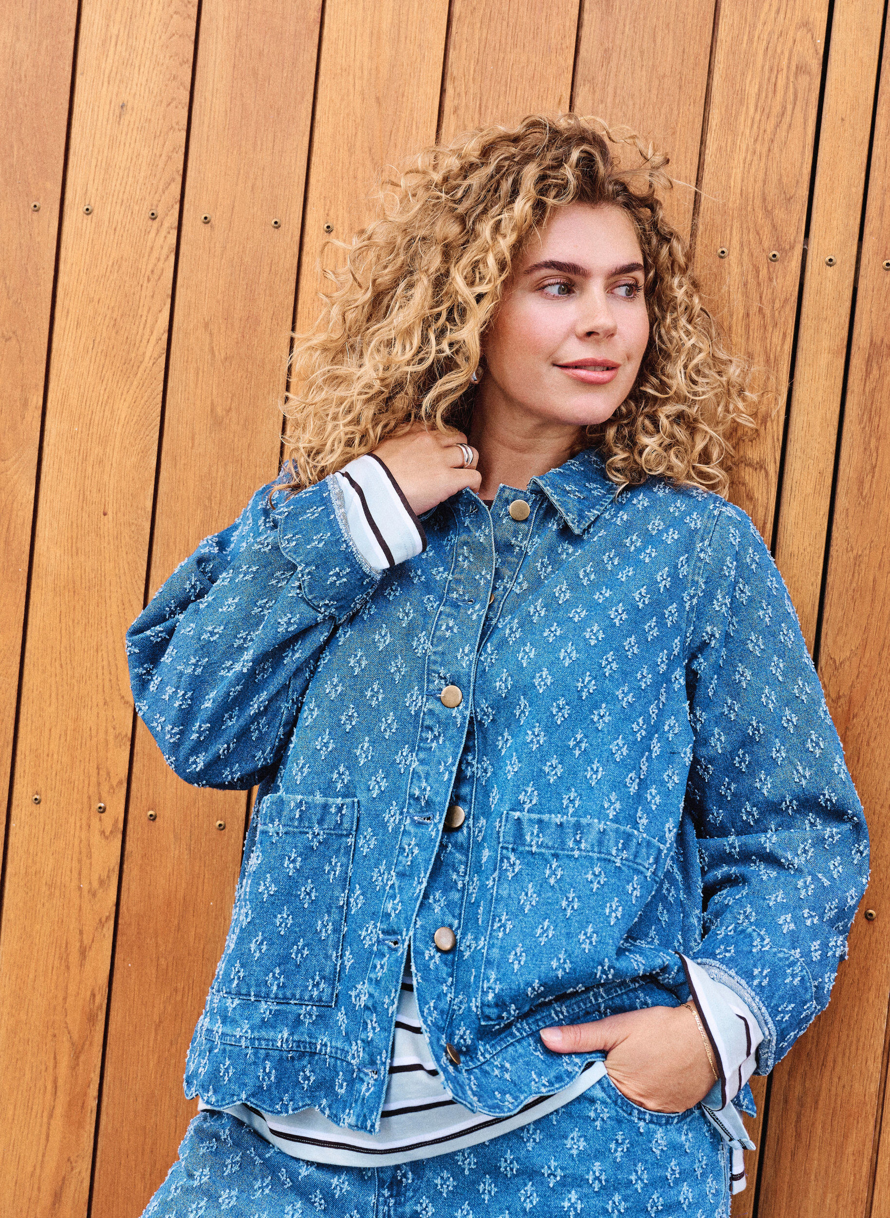 Denim jacket with a distressed pattern