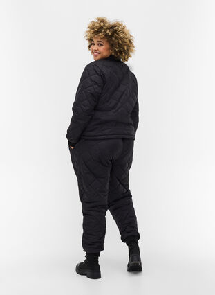Quilted 2-in-1 jumpsuit with pockets, Black, Model image number 0