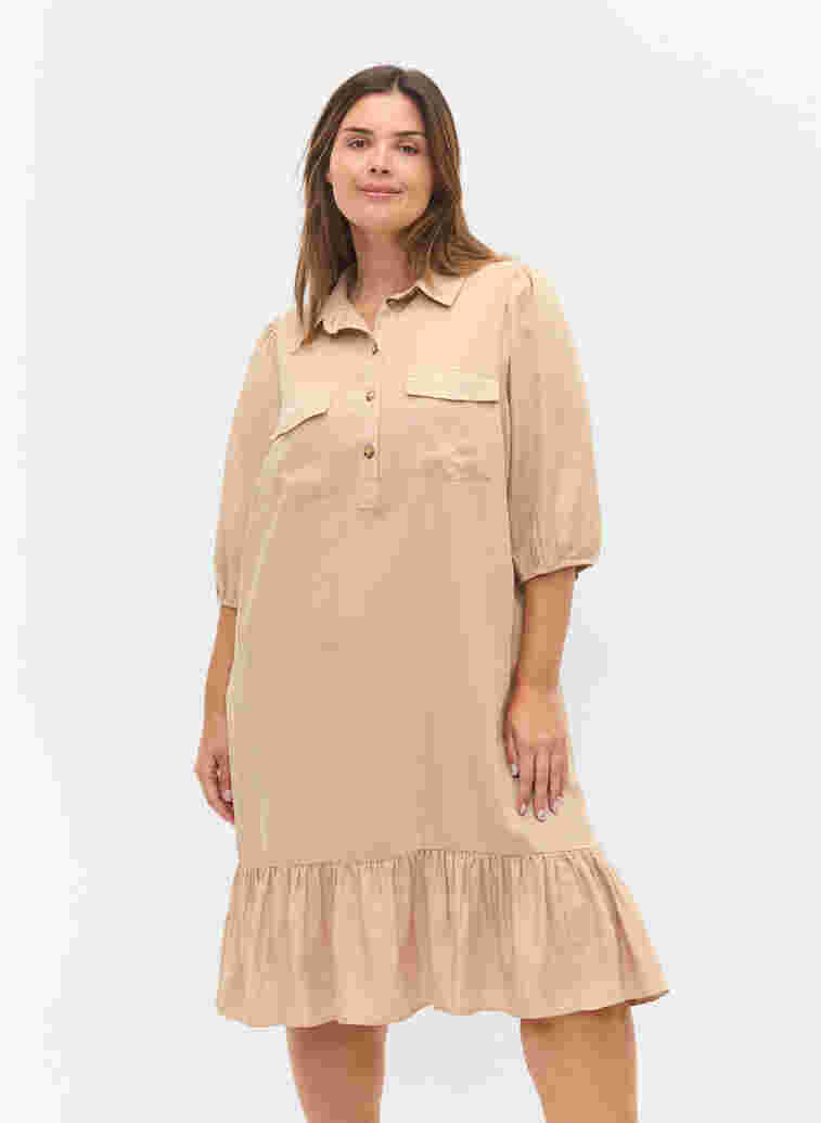 Dress with ruffle trim and 3/4 sleeves, Humus, Model
