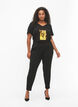 Trousers with pockets and decorative buttons, Black, Model image number 0