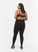 CORE, POCKET TIGHTS - Workout Leggings with side pocket, Black, Model image number 1
