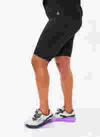 Long tight training shorts, Black, Model