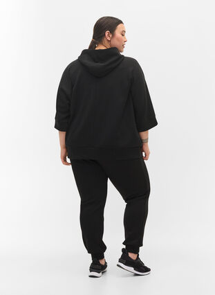 Loose joggers with pockets, Black, Model image number 1