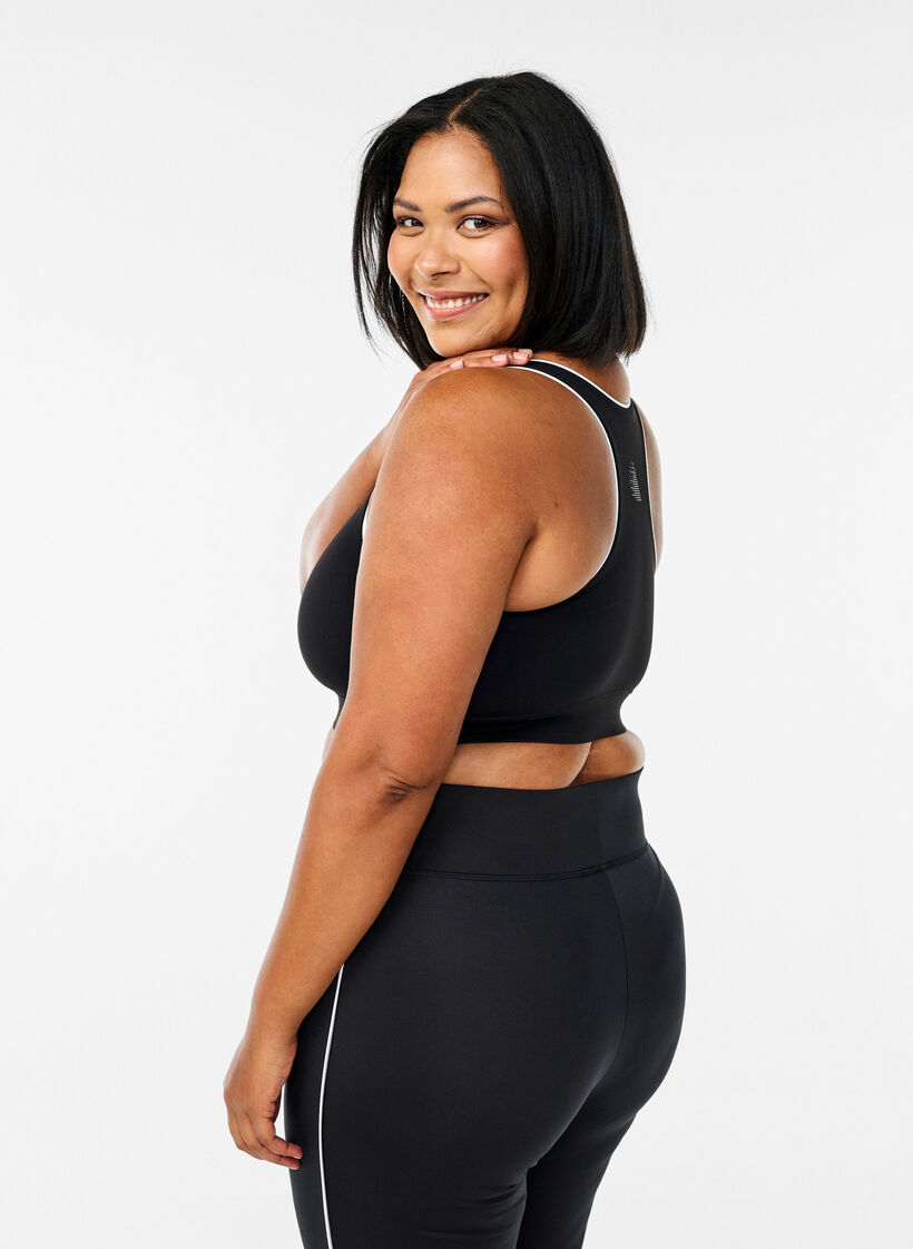 Racerback sports bra with contrast piping, Black, Model image number 2