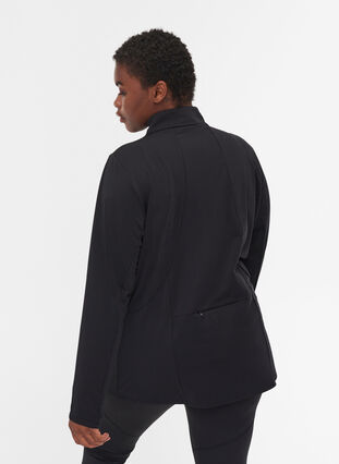 Reflective running jacket with pocket, Black, Model image number 1