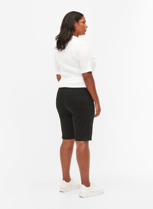Close-fitting shorts with back pockets, Black, Model image number 1