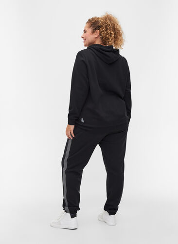 Sweatpants with a drawstring and pockets, Black, Model image number 1