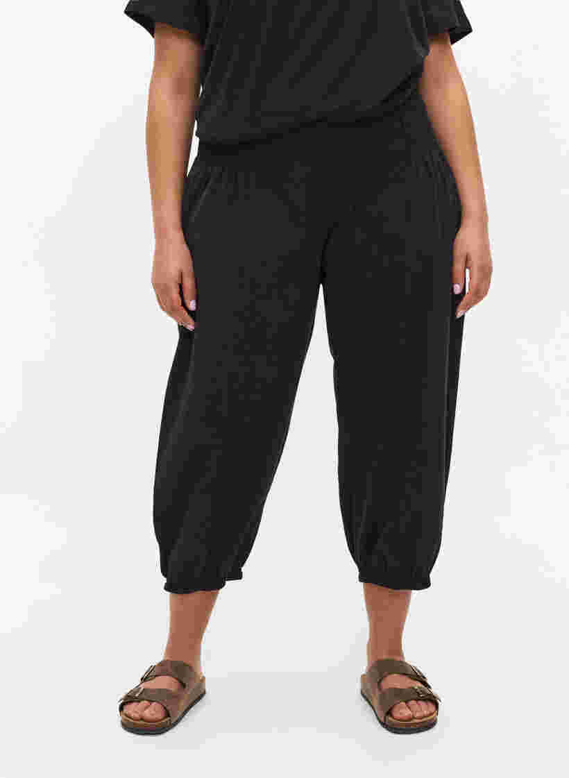 Loose 3/4-length trousers with smock detail, Black, Model image number 1
