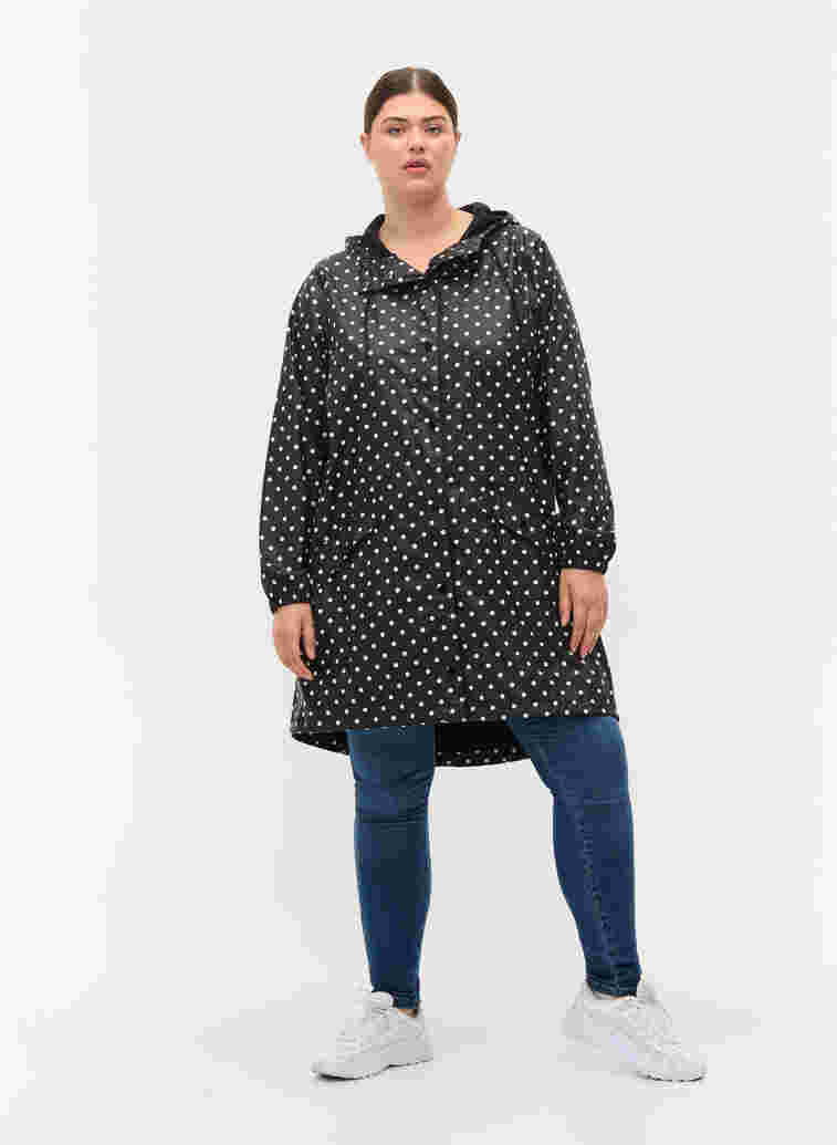 Hooded polka dot rain jacket, Black W/White Dot, Model image number 2