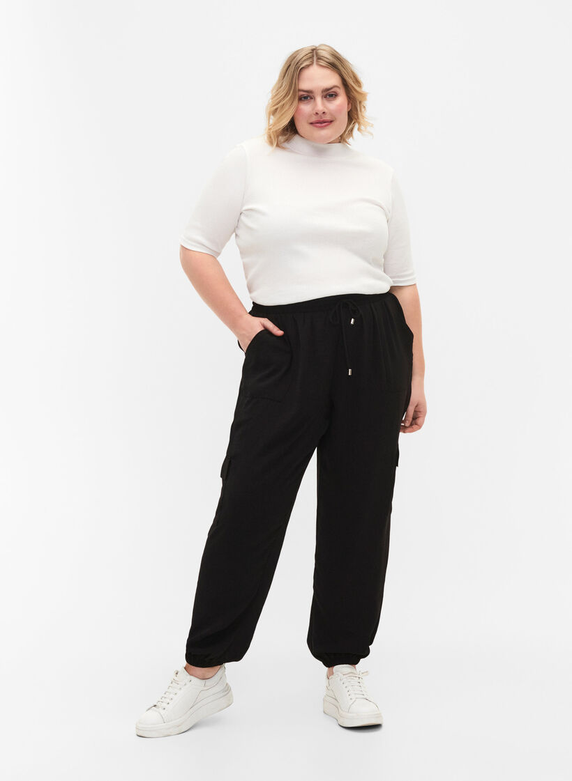 Solid coloured trousers with large pockets, Black, Model image number 0