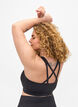 Sports bra with cross detail in the back, Black, Model image number 1