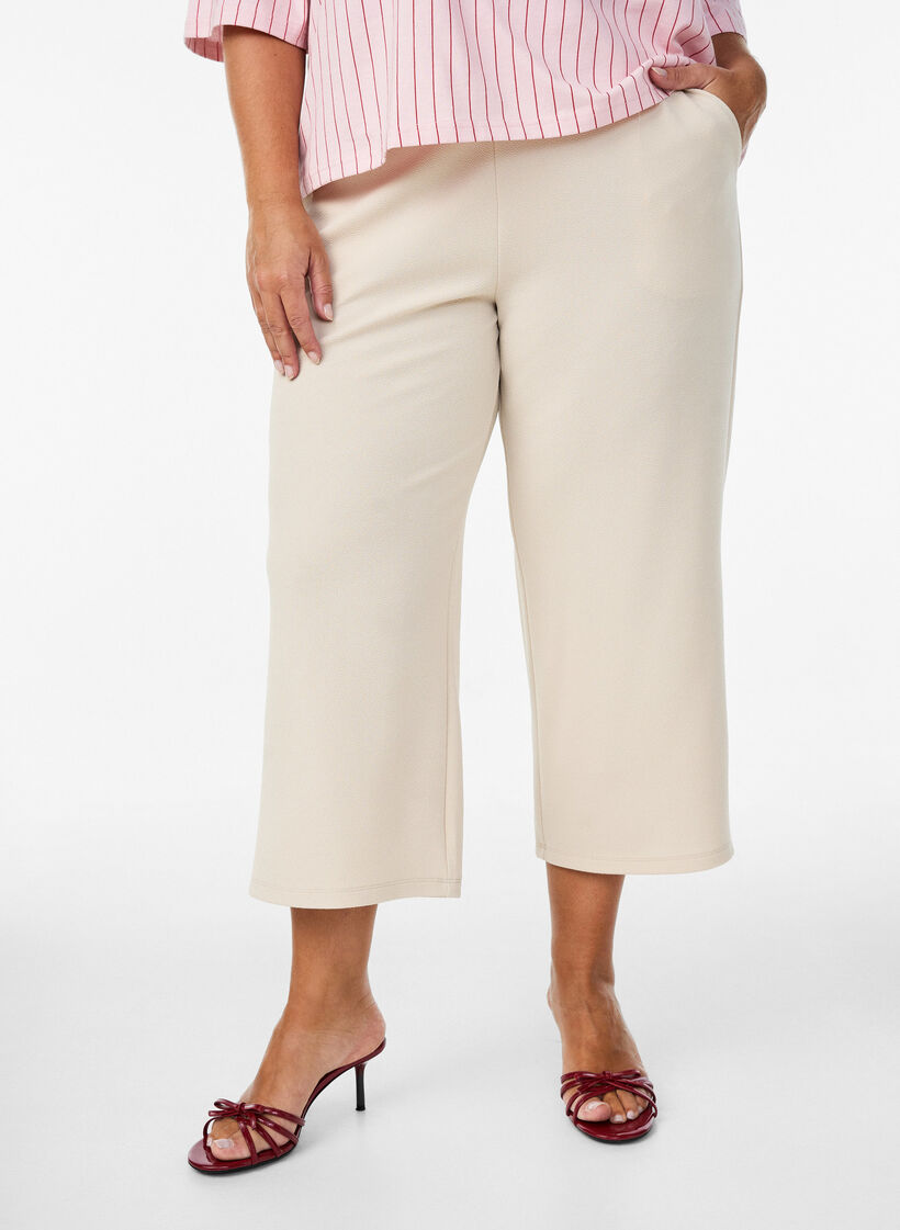 Loose trousers with 7/8 length, Beige, Model image number 2