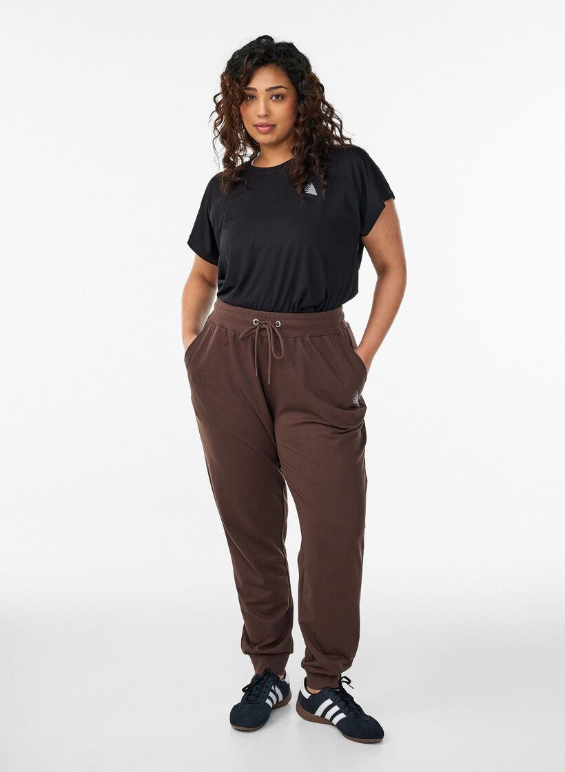 Loose tracksuit trousers with pockets, Brown, Model image number 1