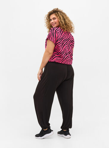 Loose-fitting trousers in viscose, Black, Model image number 1