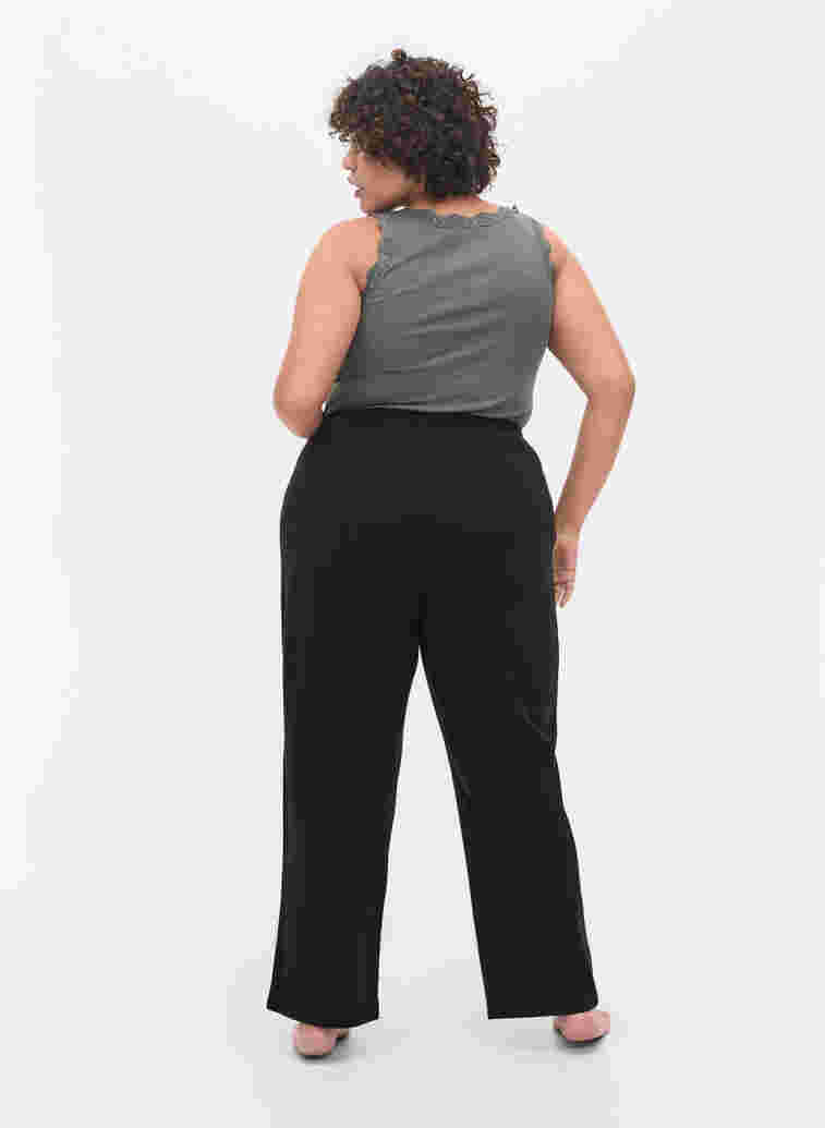Loose trousers with structure, Black, Model image number 0