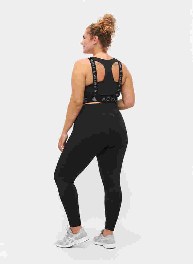 Cropped training leggings with back pocket, Black, Model image number 0