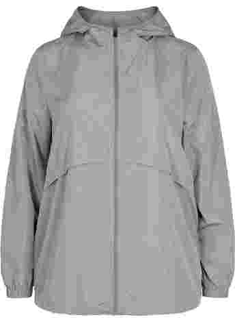 Sports jacket with hood and reflector