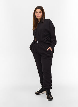 Loose viscose trousers with elastic borders and pockets, Black, Model image number 0