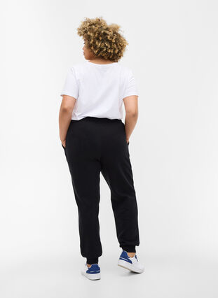 Loose sweatpants with pockets, Black, Model image number 1