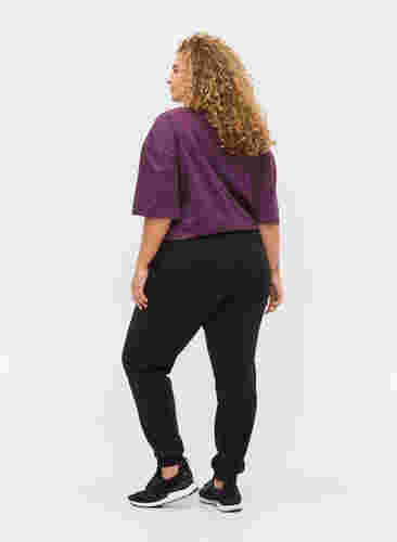 Sweatpants with tie string and pockets, Black, Model image number 1