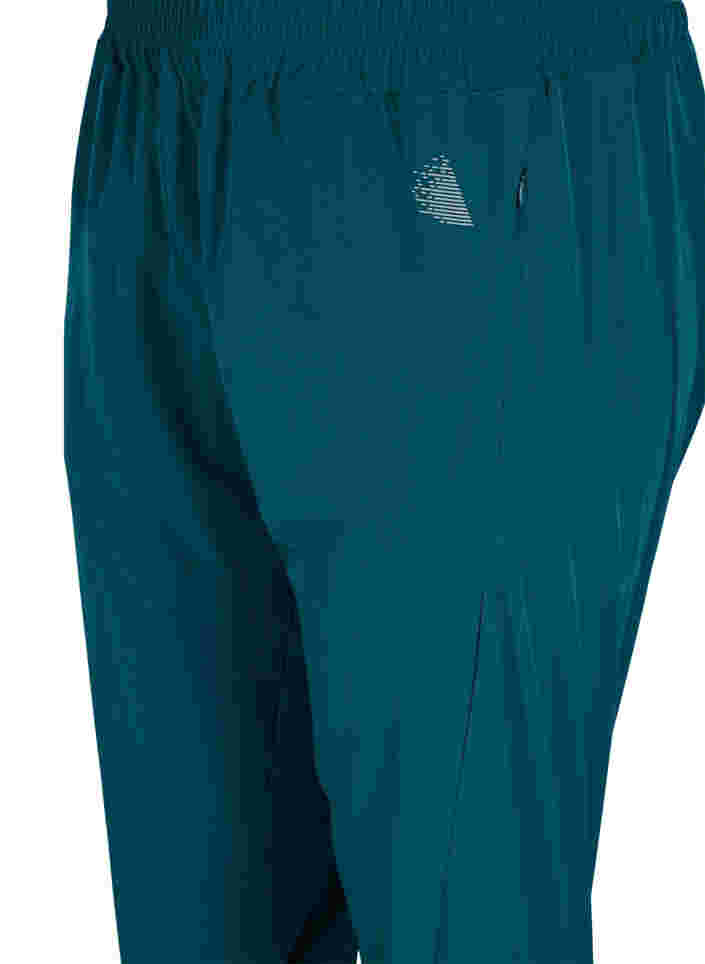Loose exercise trousers with pockets, Deep Teal, Packshot image number 2