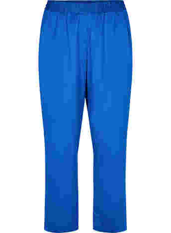 Loose fitting trousers with light shine and width