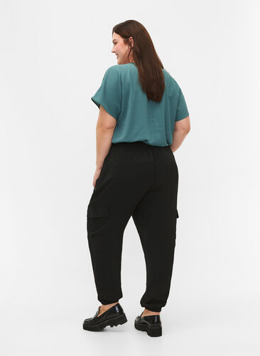 Trousers with cargo pockets, Black, Model image number 1