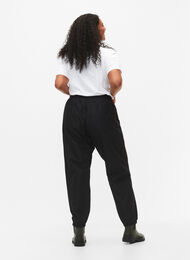Rain pants with elastic and drawstring, Black, Model