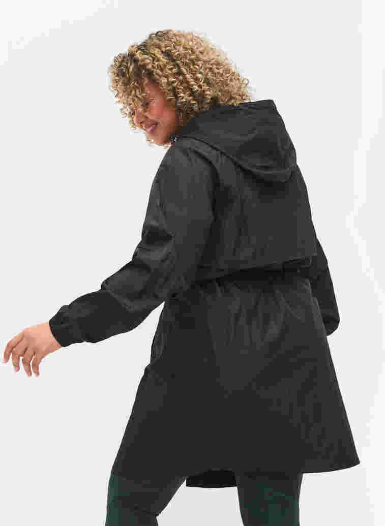 Long sports jacket with adjustable waist, Black, Model