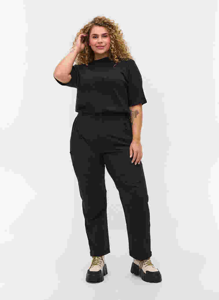 Hiking trousers with pockets, Black, Model image number 0