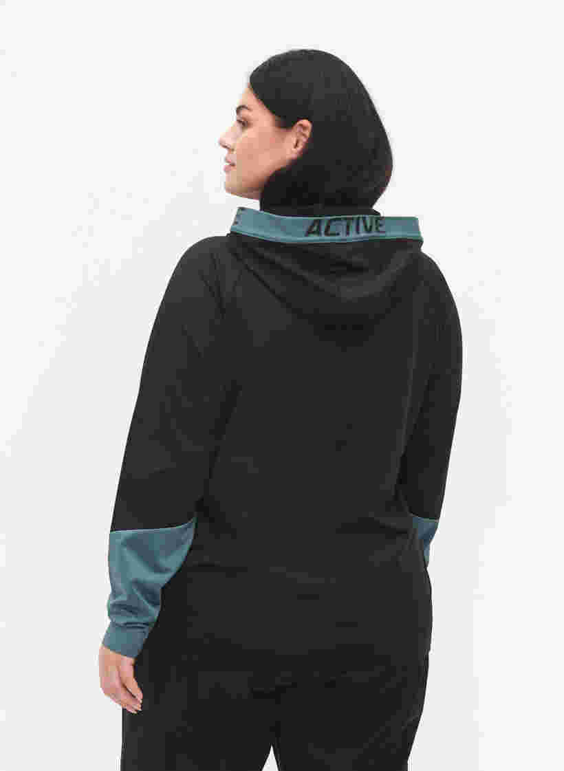 Training cardigan with hood, Black, Model image number 1