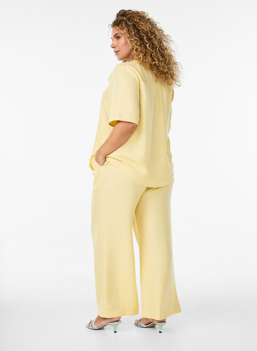 Loose trousers with elasticated waistband and pockets, Yellow, Model image number 1