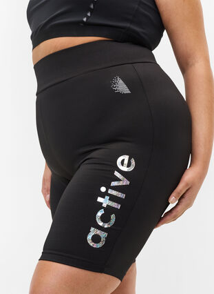 Close-fitting gym shorts with text print, Black, Model image number 1