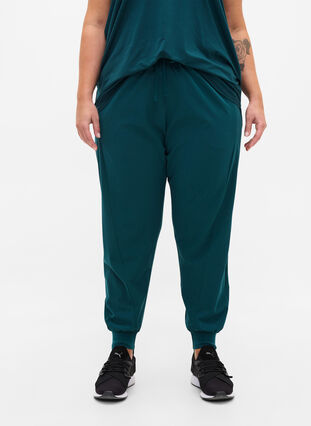 Loose exercise trousers with pockets, Deep Teal, Model image number 2