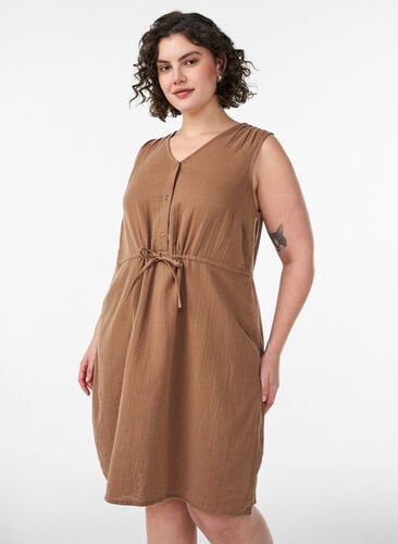 Sleeveless cotton muslin dress with tie string Sleeveless cotton muslin dress with tie string
