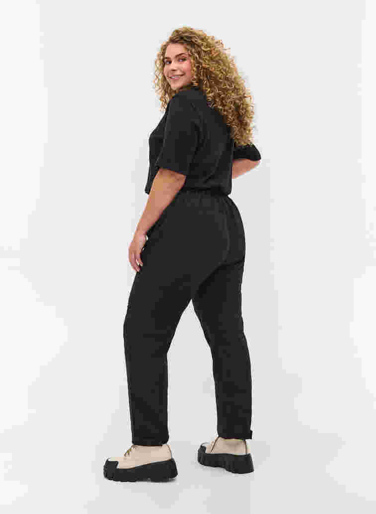 Hiking trousers with pockets, Black, Model image number 1